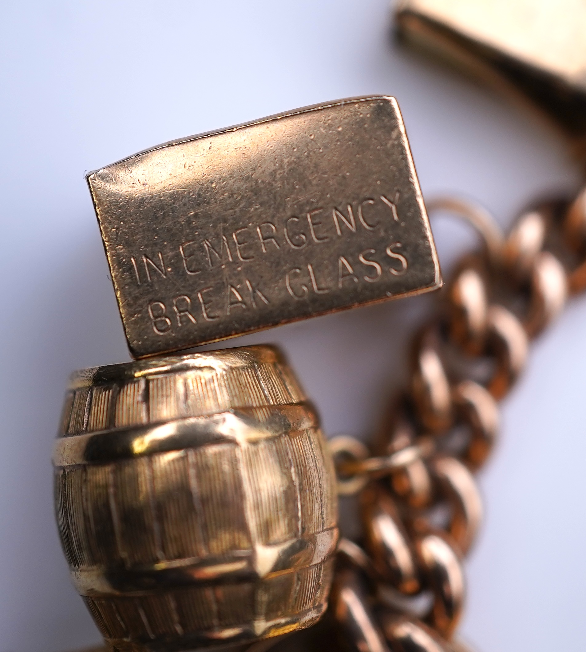 A 9ct gold charm bracelet, mid 20th century